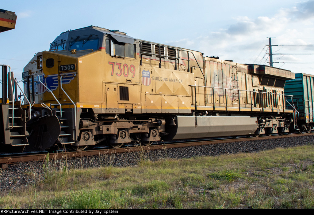 UP 7309 trails on an eastbound manifest